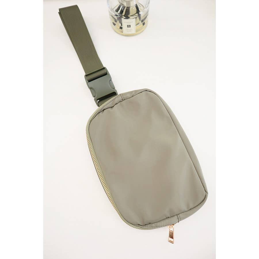 Green crossbody bag on a white background