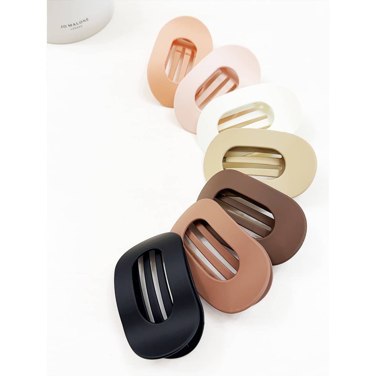 Set of colorful hair clips on a white background