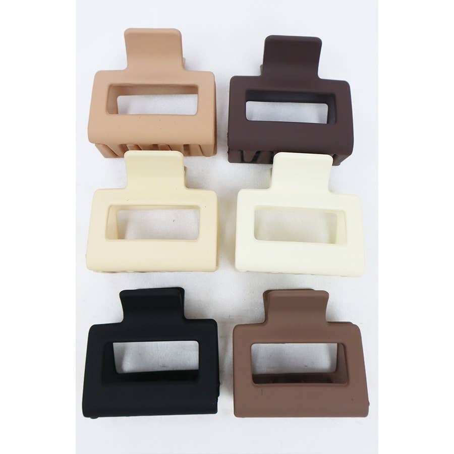 Set of six square-shaped hair clips in different colors on a white background