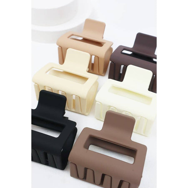 Set of square hair clips in various colors on a white background
